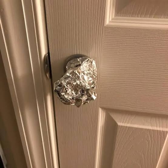 Why foil on doorknob?
