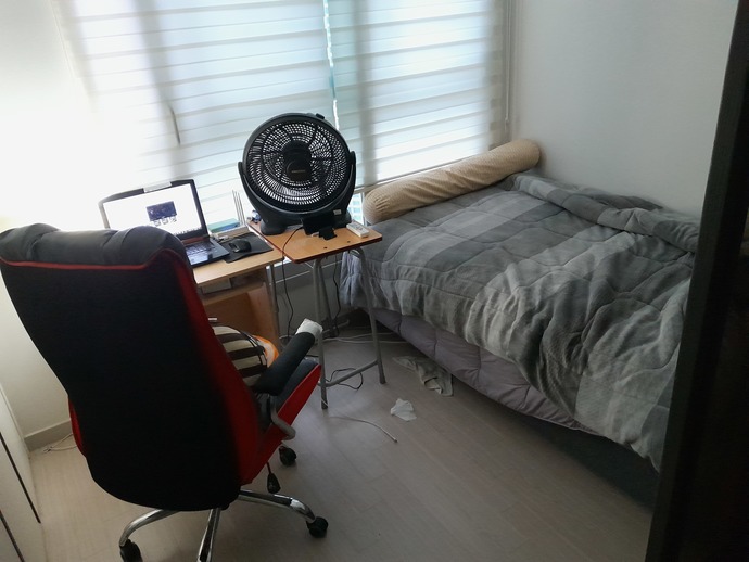My job pays for this apartment. I bought the bed myself, but I don't have to pay rent.