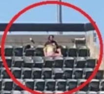 What do you think was going on in this photo at a baseball game?