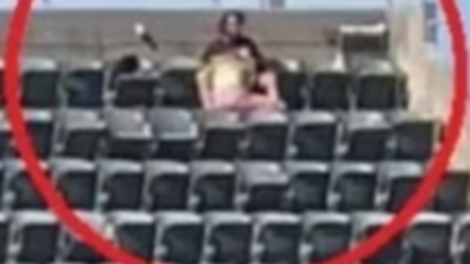 What do you think was going on in this photo at a baseball game?