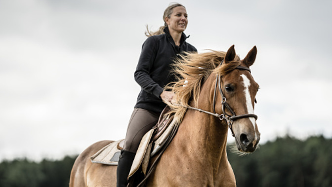 Why do so many women love horseback riding?