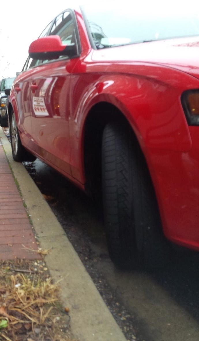 Girls, my girlfriend ends up parked like this a lot - note the back tire. Is this intentional to get attention or she is just not good at it?