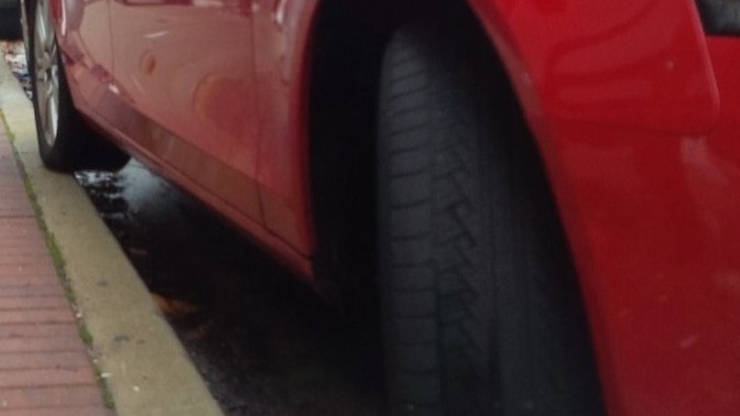 Girls, my girlfriend ends up parked like this a lot - note the back tire. Is this intentional to get attention or she is just not good at it?