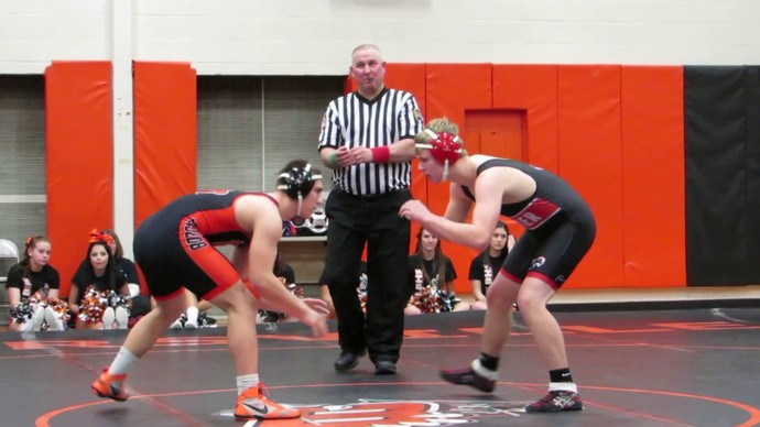 Which sport has a bigger amount of athletes competing between amateur boxing and amateur wrestling?
