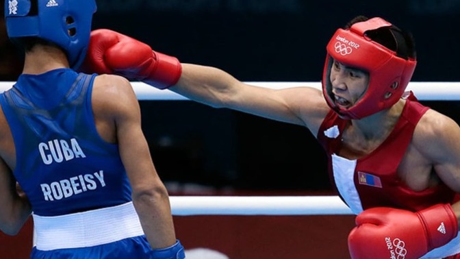 Which sport has a bigger amount of athletes competing between amateur boxing and amateur wrestling?