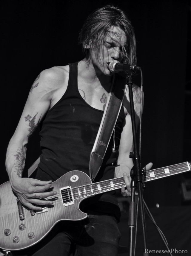 Why are men who play any type of guitar so attractive?