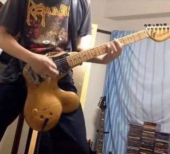 Why are men who play any type of guitar so attractive?