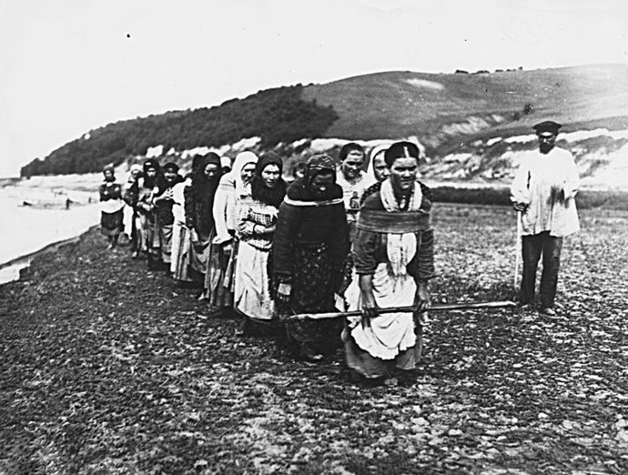 Women being led off to a work camp in western Russia in the 1950s.