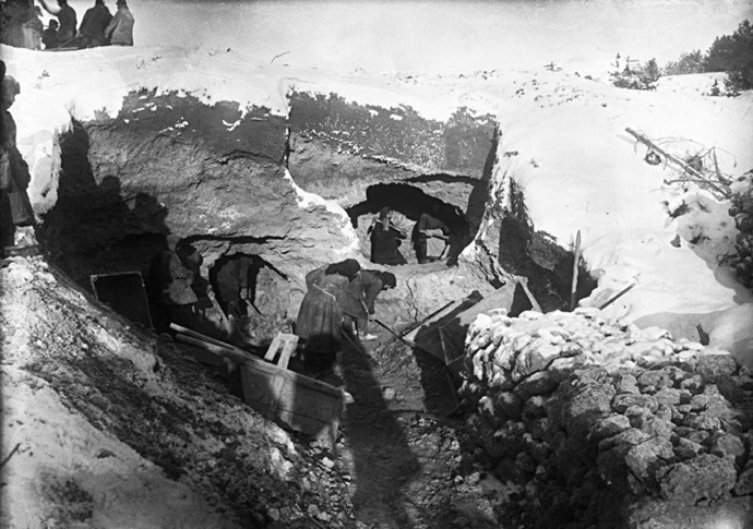 Women on a work detail building stone fences.