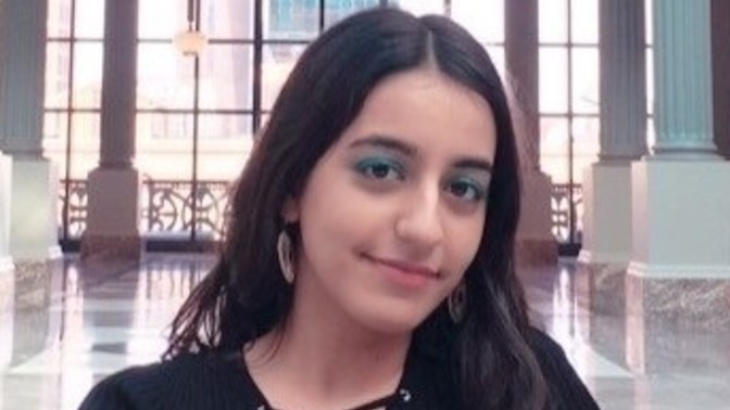 What about this picture makes it seem sexy even though she isn't showing much skin?