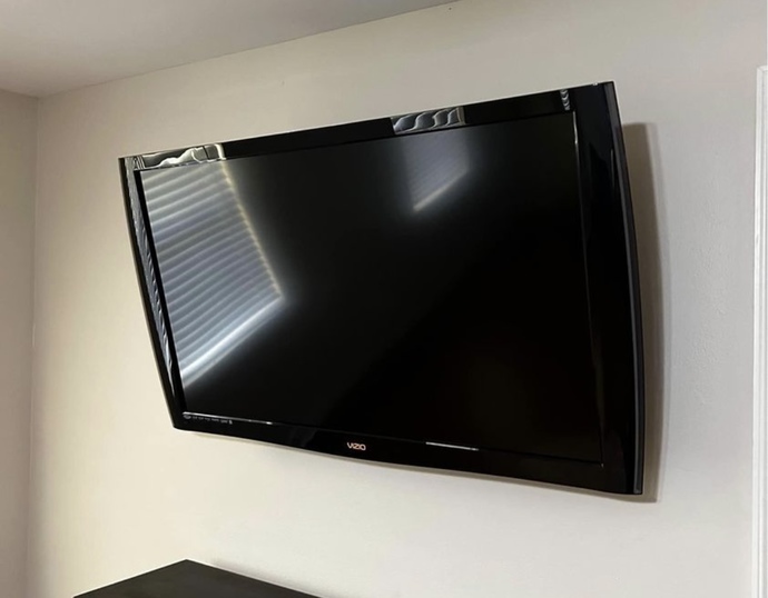 What can I buy for this to stand up on the tv stand?