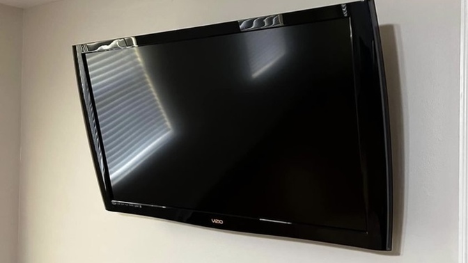 What can I buy for this to stand up on the tv stand?