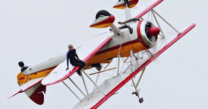 Jane Wicker (left) and pilot Charlie Schwenker perform their act high above the Vectren Air Show shortly before their fatal crash.