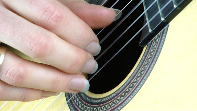 man's hands with longer fingernails