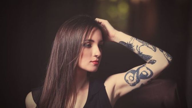 Do tattoos make a woman look trashy?