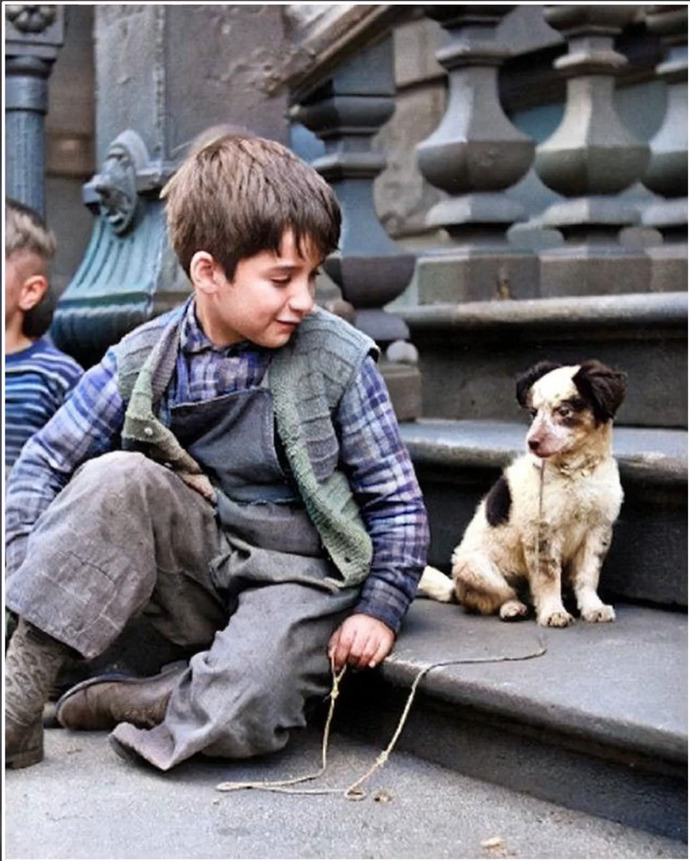What TITLE would you give this 1949 photo of a boy and his dog?