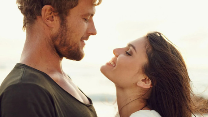 What are some hints that mean a girl is attracted to a guy?