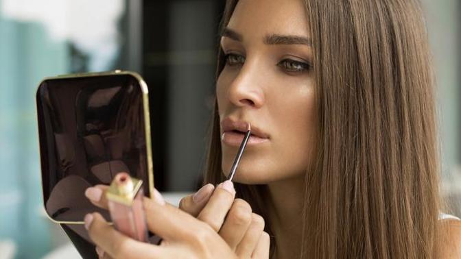 My girlfriend wear nice dress and great makeup when going out with her friends (girls) and wear normal dress with normal makeup when we meet. Why?