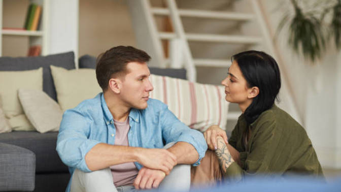 How can you bring up the topic about not liking the male friend of your husband?