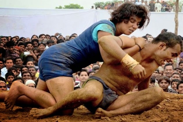What is your opinion on mixed gender wrestling? Guys, would you hold back?