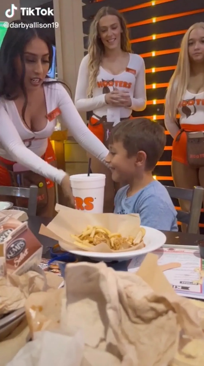 Is it appropriate for a father to take his underaged son to hooters where girls will be touching him for his birthday?