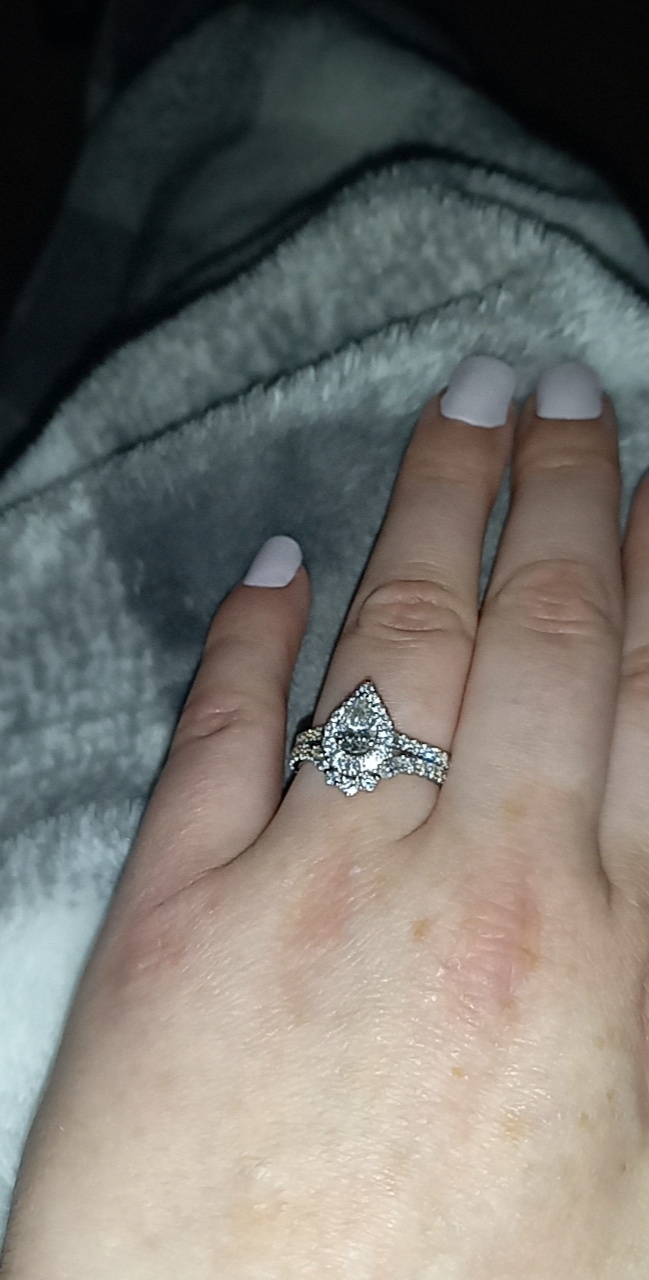 What do you think of my engagedmebt ring... and whats mind a band could I add on along with the one already on it?