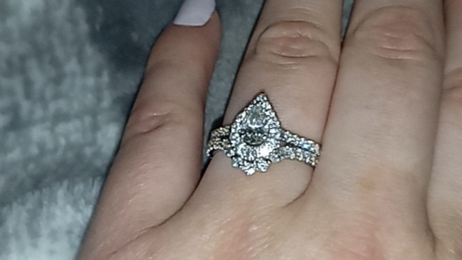 What do you think of my engagedmebt ring... and whats mind a band could I add on along with the one already on it?