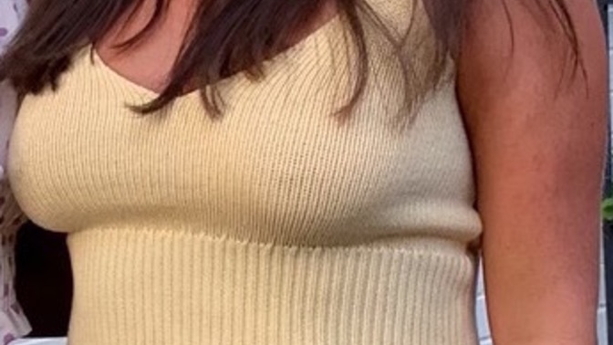 Is she wearing a bra, or is she bra-less?