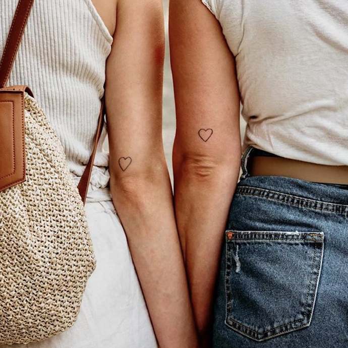 Why do girls get tattoos? Would you date a girl who has tattoos?