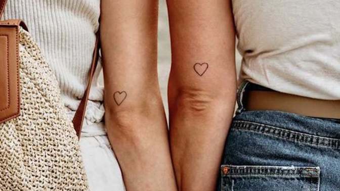Why do girls get tattoos? Would you date a girl who has tattoos?