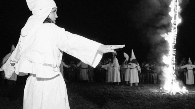 Am I wrong to not care about my girlfriend being in the KKK since it is how she was raised?