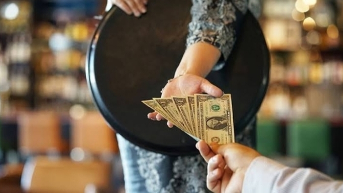 Do you tip the waiter and valet in restaurants?