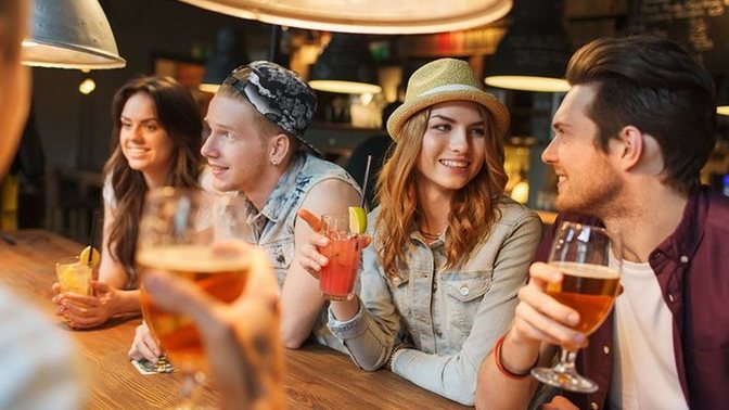 What does it mean when a guy is talking to you at a bar, and offers to buy all of your friends drinks?
