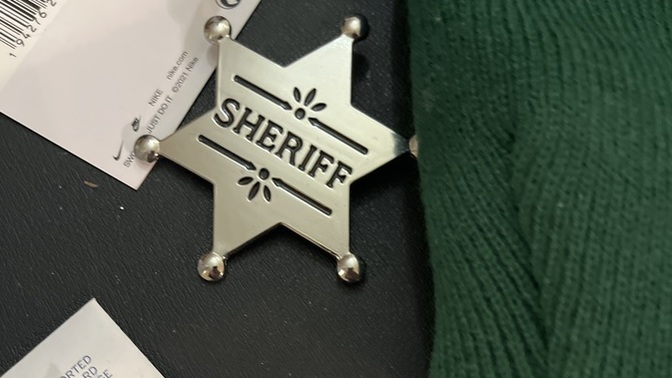 Why does my stepdad have a sheriff badge on his desk even though he was never in law enforcement?