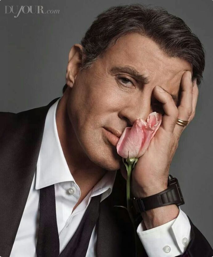 From the list of "Top Greatest Male Hollywood Physiques", whose wife is the strongest?