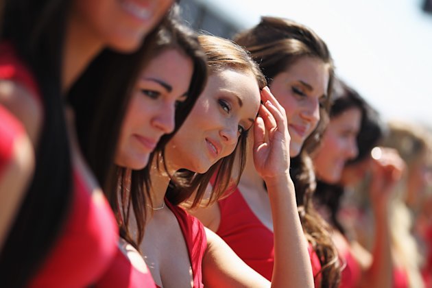 A line of women extending around the world... tops can stay on...