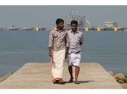 It can be worn in full length or folded to knee or above knee length (2nd guy)