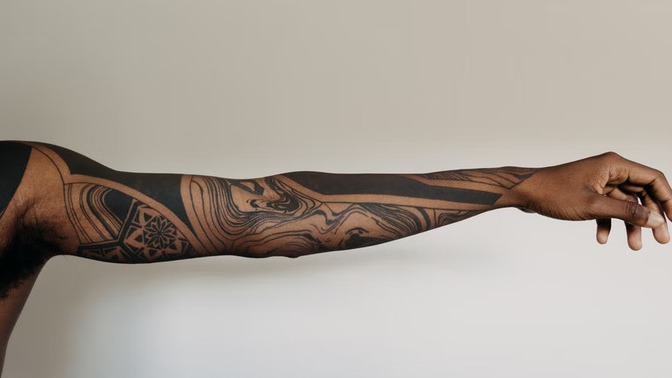 Where is the least painful place to have a tattoo?