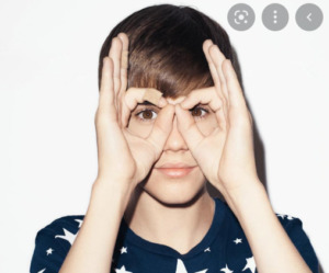 Justin is a girl showing occult symbols?