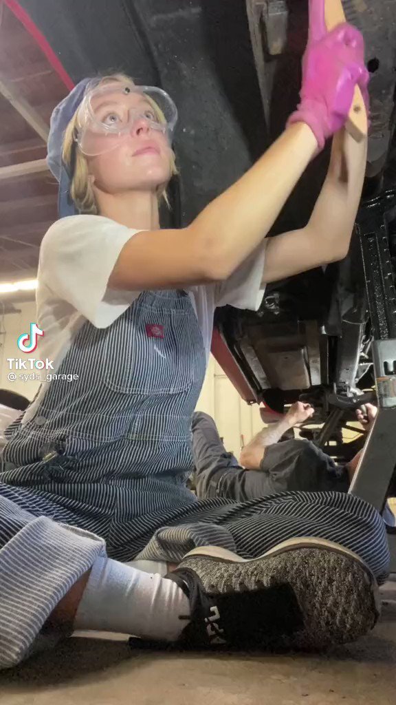 working on her own truck...
