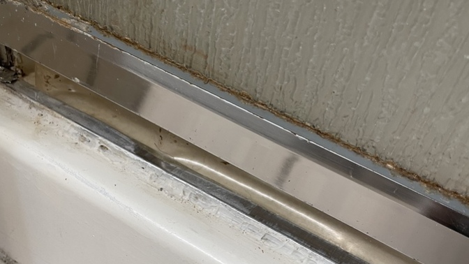 How do I remove grout from shower door? How can I add a curtain to my shower door?