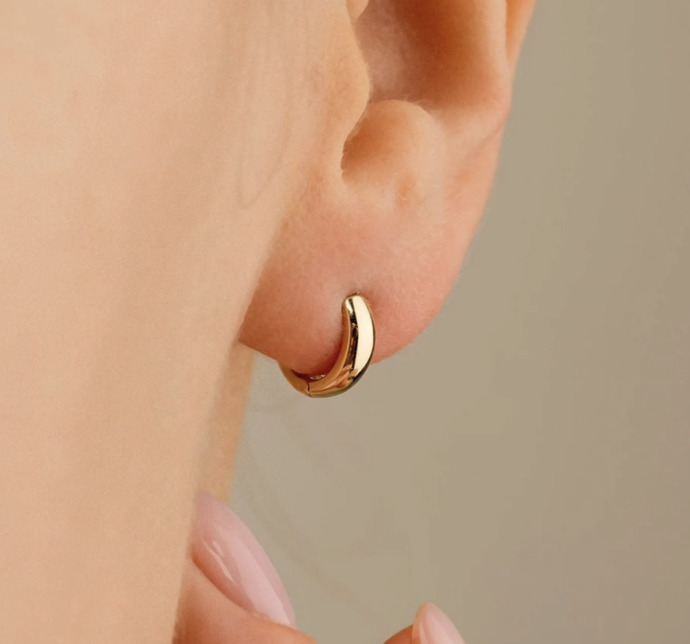Which one of these earrings would look best with this tiny cross necklace?