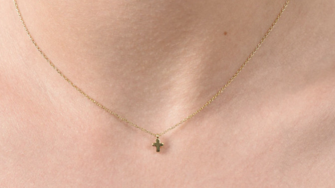 Which one of these earrings would look best with this tiny cross necklace?