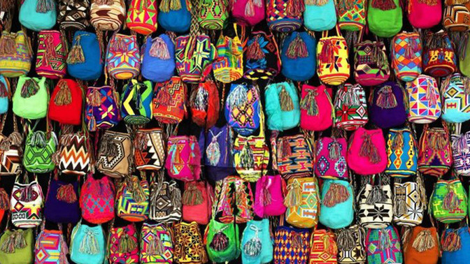 Can you find the man hiding among these bags?
