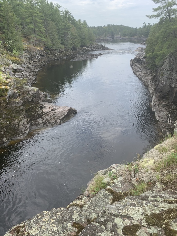 I come here, sit on my chair and listen to the water flowing between the rocks.