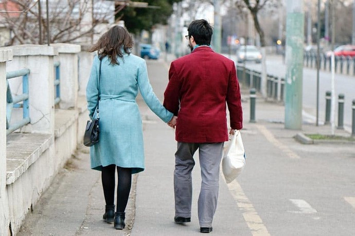 Girls, how do you view the act of a guy walking with you on the street side of the sidewalk?