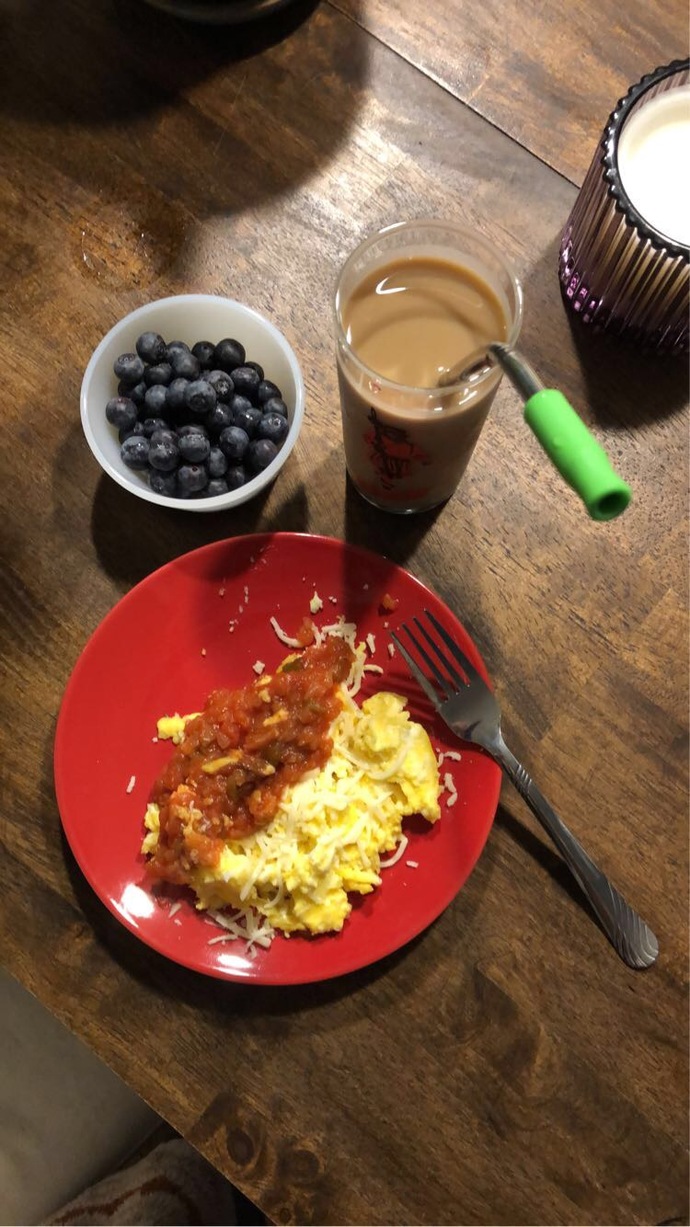 2 eggs with salsa and cheese on top. Blueberries. Cold brew with milk. 