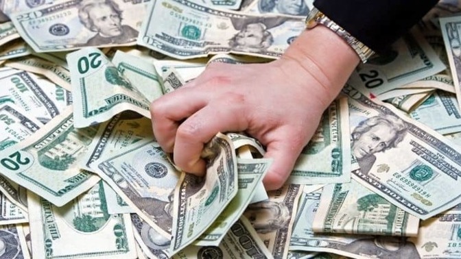 How do I deal with having a man who's obsessed with money?