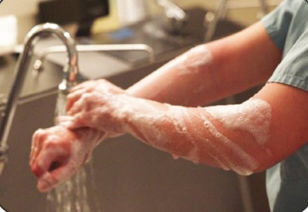 Why Doctors/surgeons have fair arms than normal? What exactly do they use to wash?
