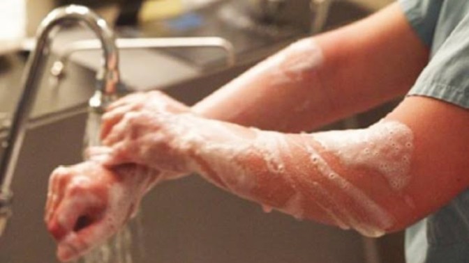 Why Doctors/surgeons have fair arms than normal? What exactly do they use to wash?